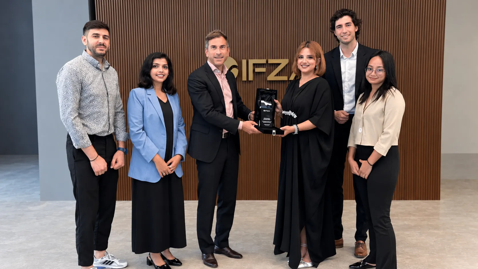 The Bestax Chartered Accountants team in Dubai, receiving an award at the IFZA offices
