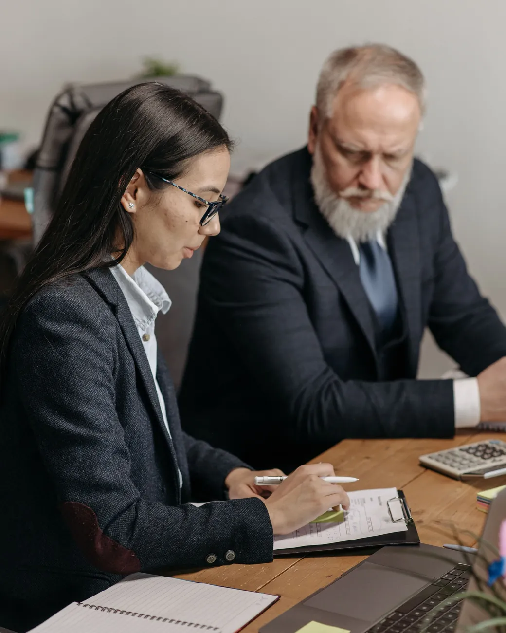 A Bestax tax agent taking a client through their VAT refund position before the claim is submitted.