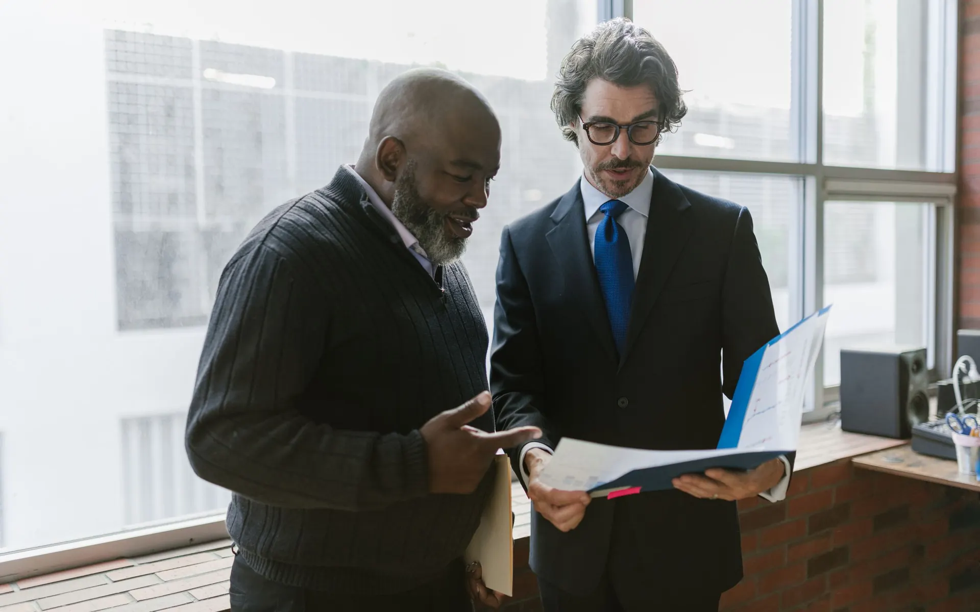 Two Bestax advisers reconciling a client's VAT credit against filed returns and purchase records.