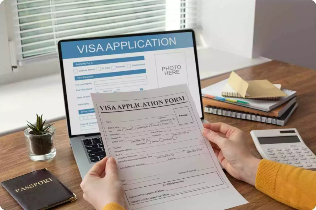 person holding visa application form 