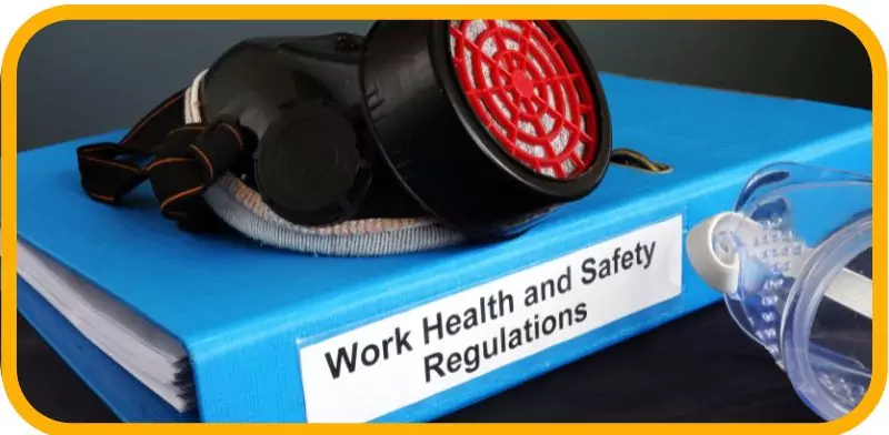 How to Start a Food Truck Business in Dubai in 2025 7 blue binder labeled "Work Health and Safety Regulations" with a safety mask and goggles.