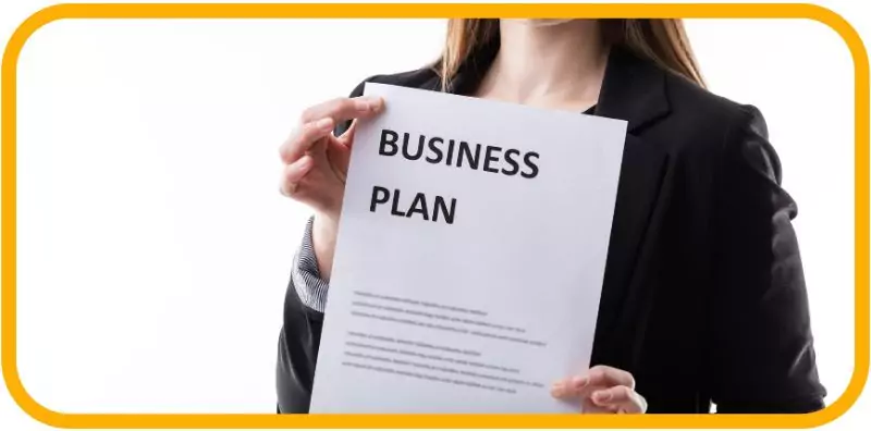 How to Start a Food Truck Business in Dubai in 2025 3 professional holding a document titled "Business Plan.